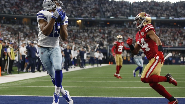 Jan 16, 2022; Arlington, Texas, USA; Dallas Cowboys wide receiver Amari Cooper (19) catches a touchdown pass in the second quarter against San Francisco 49ers defensive back K'Waun Williams (24) in a NFC Wild Card playoff football game at AT&T Stadium. Mandatory Credit: Tim Heitman-USA TODAY Sports