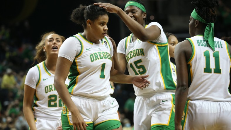 Oregon's Nyara Sabally, center, is congradulated by teammates during the game against Arizona in Eugene Saturday Jan. 15, 2022.

Fb Eug 011522 Uo Women Bkb 21