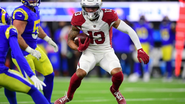 Jan 17, 2022; Inglewood, California, USA; Arizona Cardinals wide receiver Christian Kirk (13) runs the ball against the Los Angeles Rams during the second half in the NFC Wild Card playoff football game at SoFi Stadium. Mandatory Credit: Gary A. Vasquez-USA TODAY Sports