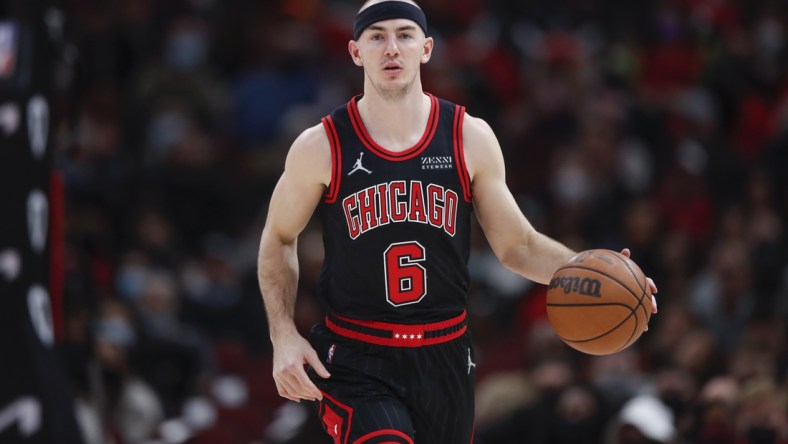 Jan 19, 2022; Chicago, Illinois, USA; Chicago Bulls guard Alex Caruso (6) brings the ball up court against the Cleveland Cavaliers during the first half at United Center. Mandatory Credit: Kamil Krzaczynski-USA TODAY Sports