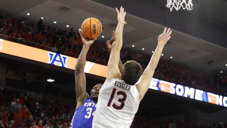 Jan 22, 2022; Auburn, Alabama, USA;  Kentucky Wildcats forward Oscar Tshiebwe (34) takes a shot as Auburn Tigers forward Walker Kessler (13) defends during the first half at Auburn Arena. Mandatory Credit: John Reed-USA TODAY Sports