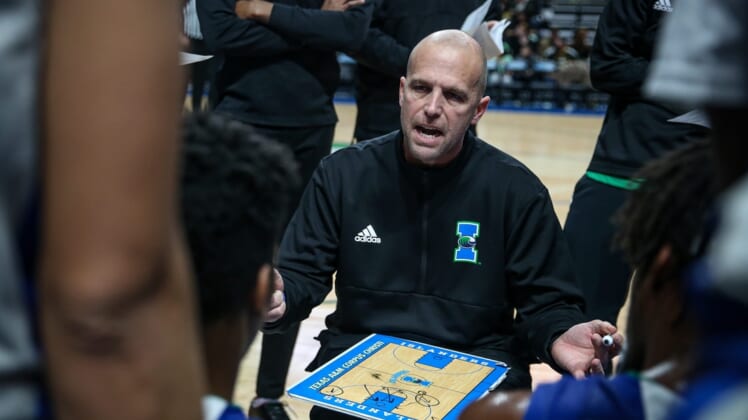 TAMUCC's Head Coach, Steve Lutz goes over strategy with the team during a timeout. Houston Baptist University Huskies defeated Texas A&M University-Corpus Christi Islanders, 77-71, on Saturday, Jan. 22, 2022, at the American Bank Center in Corpus Christi, Texas.