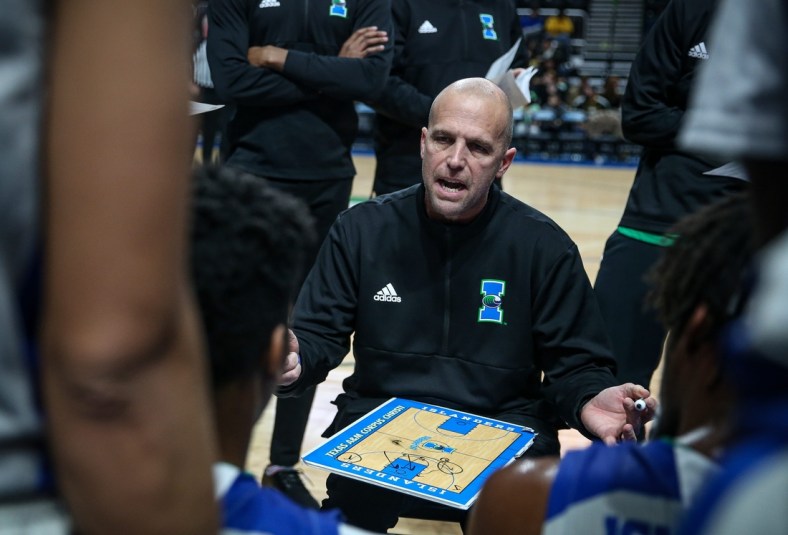 TAMUCC's Head Coach, Steve Lutz goes over strategy with the team during a timeout. Houston Baptist University Huskies defeated Texas A&M University-Corpus Christi Islanders, 77-71, on Saturday, Jan. 22, 2022, at the American Bank Center in Corpus Christi, Texas.