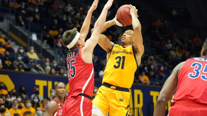 Jan 23, 2022; Berkeley, California, USA; California Golden Bears guard Jordan Shepherd (31) scores over Arizona Wildcats guard Kerr Kriisa (25) during the second half at Haas Pavilion. Mandatory Credit: Darren Yamashita-USA TODAY Sports