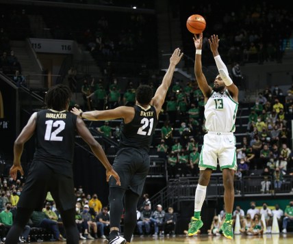 Oregon's Quincy Guerrier, right, shots a 3-point shot over Colorado's Evan Battey during the second half.

Eug 012522 Uo Co Men 09