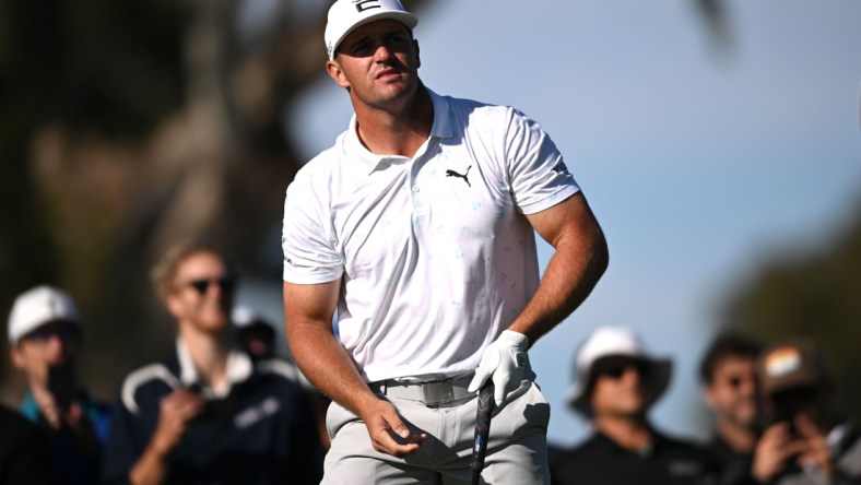 Jan 27, 2022; San Diego, California, USA; Bryson DeChambeau watches his shot from the ninth tee during the first round of the Farmers Insurance Open golf tournament at Torrey Pines Municipal Golf Course - North Course. Mandatory Credit: Orlando Ramirez-USA TODAY Sports