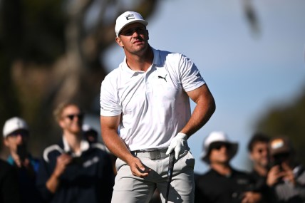 Jan 27, 2022; San Diego, California, USA; Bryson DeChambeau watches his shot from the ninth tee during the first round of the Farmers Insurance Open golf tournament at Torrey Pines Municipal Golf Course - North Course. Mandatory Credit: Orlando Ramirez-USA TODAY Sports