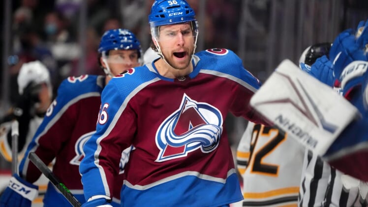 Jan 26, 2022; Denver, Colorado, USA; Colorado Avalanche defenseman Kurtis MacDermid (56) reacts after scoring a goal in the first period against the Boston Bruins at Ball Arena. Mandatory Credit: Ron Chenoy-USA TODAY Sports
