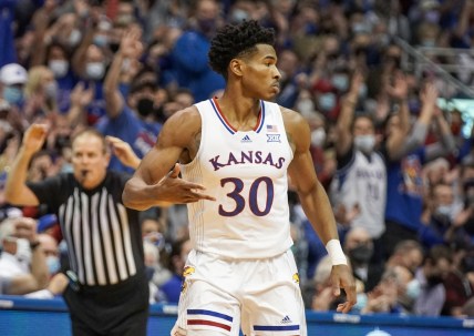 Jan 24, 2022; Lawrence, Kansas, USA; Kansas Jayhawks guard Ochai Agbaji (30) celebrates after shooting a three point basket against the Texas Tech Red Raiders during the game at Allen Fieldhouse. Mandatory Credit: Denny Medley-USA TODAY Sports