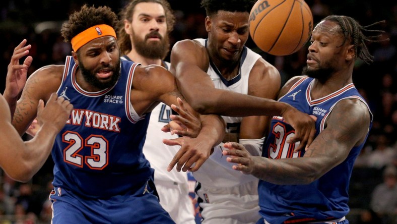 Feb 2, 2022; New York, New York, USA; Memphis Grizzlies forward Jaren Jackson Jr. (13) and center Steven Adams (4) fight for a rebound against New York Knicks center Mitchell Robinson (23) and forward Julius Randle (30) during the third quarter at Madison Square Garden. Mandatory Credit: Brad Penner-USA TODAY Sports