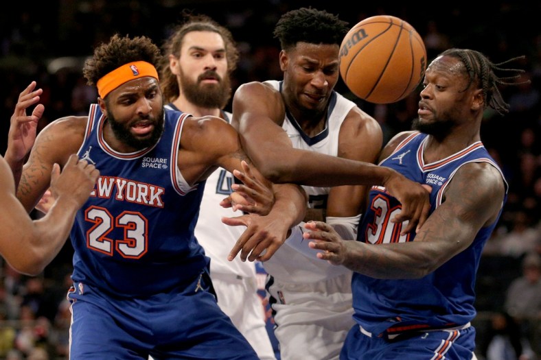 Feb 2, 2022; New York, New York, USA; Memphis Grizzlies forward Jaren Jackson Jr. (13) and center Steven Adams (4) fight for a rebound against New York Knicks center Mitchell Robinson (23) and forward Julius Randle (30) during the third quarter at Madison Square Garden. Mandatory Credit: Brad Penner-USA TODAY Sports