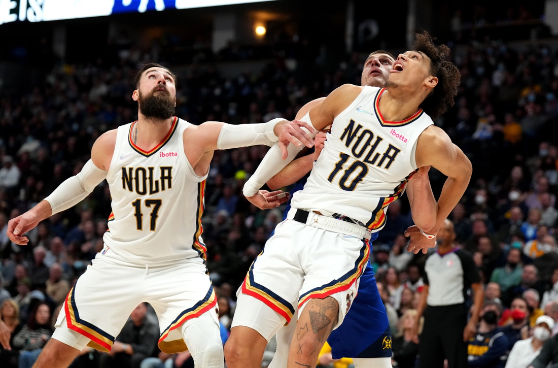 Feb 4, 2022; Denver, Colorado, USA; New Orleans Pelicans center Jonas Valanciunas (17) and center Jaxson Hayes (10) block out Denver Nuggets center Nikola Jokic (15) in the second half at Ball Arena. Mandatory Credit: Ron Chenoy-USA TODAY Sports