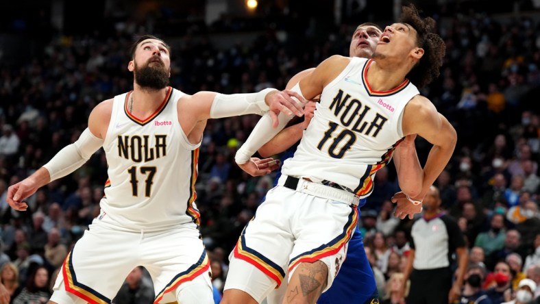 Feb 4, 2022; Denver, Colorado, USA; New Orleans Pelicans center Jonas Valanciunas (17) and center Jaxson Hayes (10) block out Denver Nuggets center Nikola Jokic (15) in the second half at Ball Arena. Mandatory Credit: Ron Chenoy-USA TODAY Sports