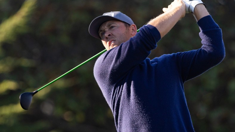 Feb 6, 2022; Pebble Beach, California, USA; Seamus Power plays his shot from the first tee during the final round of the AT&T Pebble Beach Pro-Am golf tournament at Pebble Beach Golf Links. Mandatory Credit: Bill Streicher-USA TODAY Sports