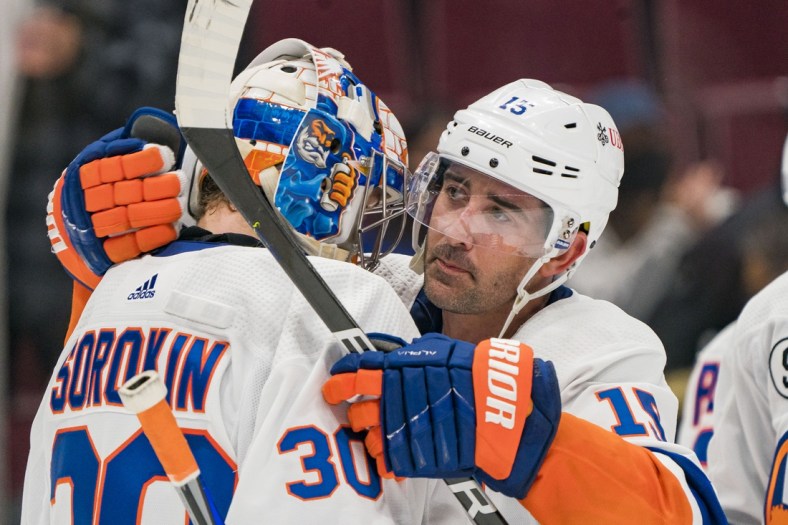 Feb 9, 2022; Vancouver, British Columbia, CAN; New York Islanders forward Cal Clutterbuck (15) and goalie Ilya Sorokin (30) celebrate their victory against the Vancouver Canucks at Rogers Arena. New York won 6-3. Mandatory Credit: Bob Frid-USA TODAY Sports