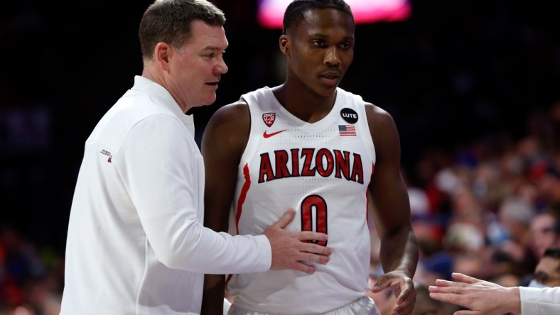 Feb 3, 2022; Tucson, Arizona, USA; Arizona Wildcats head coach Tommy Lloyd talks with guard Bennedict Mathurin (0) during the first half against the UCLA Bruins at McKale Center. Mandatory Credit: The Wildcats beat the Bruins 76-66. Chris Coduto-USA TODAY Sports