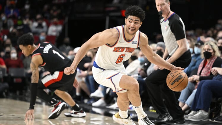 Feb 12, 2022; Portland, Oregon, USA;  New York Knicks guard Quentin Grimes (6) steals the basket ball during the the second half against Portland Trail Blazers guard Anfernee Simons (1) at Moda Center. Mandatory Credit: Troy Wayrynen-USA TODAY Sports