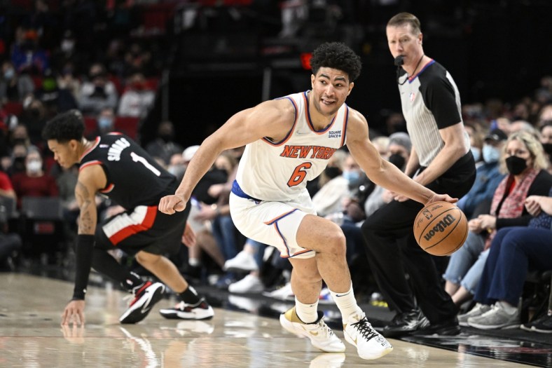 Feb 12, 2022; Portland, Oregon, USA;  New York Knicks guard Quentin Grimes (6) steals the basket ball during the the second half against Portland Trail Blazers guard Anfernee Simons (1) at Moda Center. Mandatory Credit: Troy Wayrynen-USA TODAY Sports
