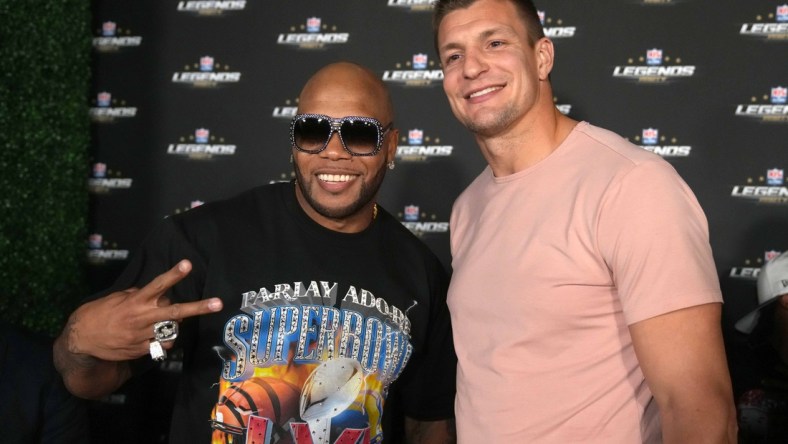 Feb 11, 2022; Los Angeles, CA, USA; Rapper and recording arist Flo Rida (left) poses with Tampa Bay Buccaneers tight end Rob Gronkowski during the NFL Alumni Legends Party Presented by USA TODAY NETWORK Ventures at Avalon Hollywood. Mandatory Credit: Kirby Lee-USA TODAY Sports