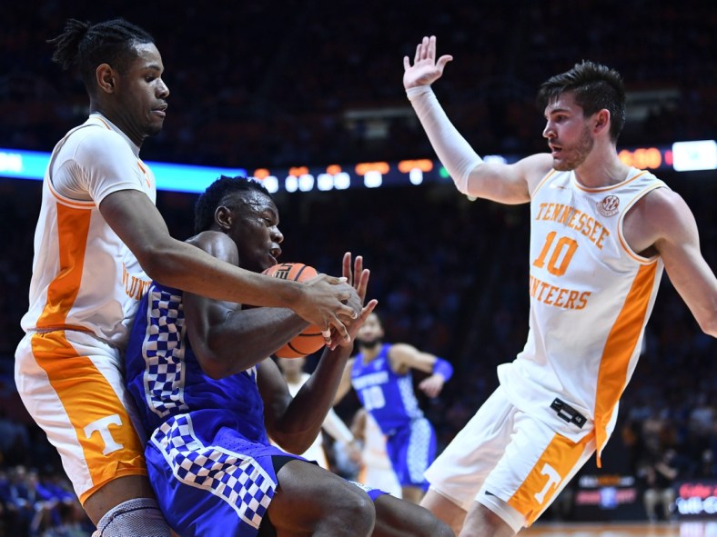 Tennessee forwards Jonas Aidoo (0) and John Fulkerson (10) surround Kentucky forward Oscar Tshiebwe (34) as the grabs the rebound during the NCAA college basketball game between the Kentucky Wildcats and Tennessee Volunteers in Knoxville, Tenn. on Tuesday, February 15, 2022.

Px Uthoops Kentucky