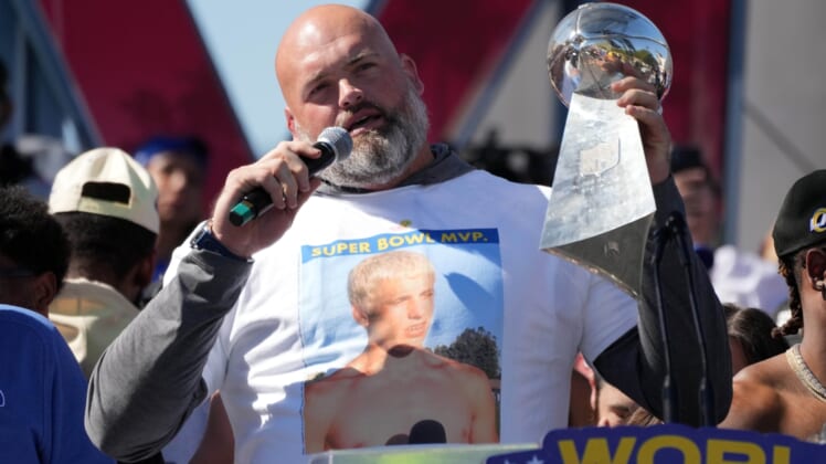 Feb 16, 2022; Los Angeles, CA, USA; Los Angeles Rams tackle Andrew Whitworth holds the Vince Lombardi trophy during the Super Bowl LVI championship rally at the Los Angeles Memorial Coliseum. Mandatory Credit: Kirby Lee-USA TODAY Sports
