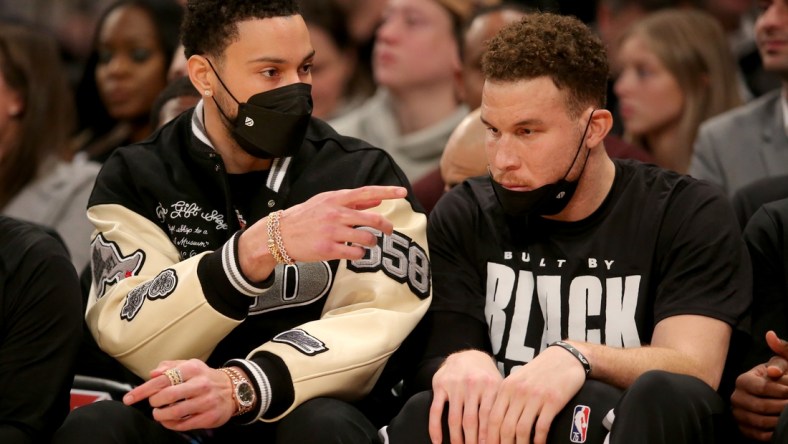 Feb 16, 2022; New York, New York, USA; Brooklyn Nets guard Ben Simmons (10) talks to forward Blake Griffin (2) on the bench during the first quarter against the New York Knicks at Madison Square Garden. Mandatory Credit: Brad Penner-USA TODAY Sports