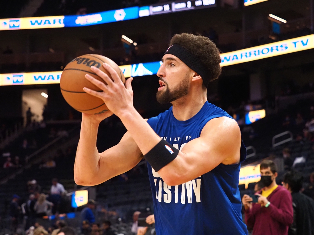 Feb 16, 2022; San Francisco, California, USA; Golden State Warriors guard Klay Thompson (11) warms up before the game against the Denver Nuggets at Chase Center. Mandatory Credit: Kelley L Cox-USA TODAY Sports