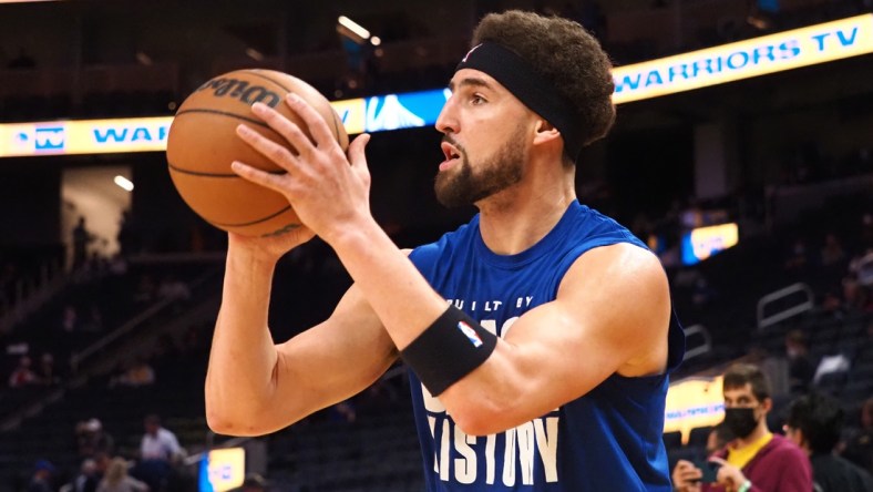 Feb 16, 2022; San Francisco, California, USA; Golden State Warriors guard Klay Thompson (11) warms up before the game against the Denver Nuggets at Chase Center. Mandatory Credit: Kelley L Cox-USA TODAY Sports