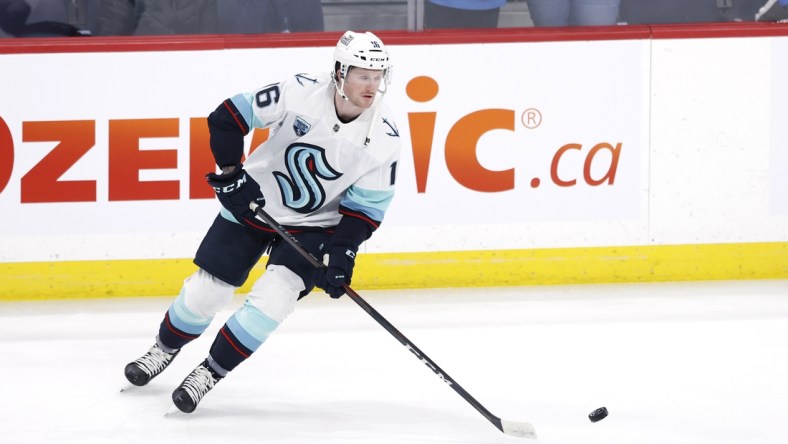 Feb 17, 2022; Winnipeg, Manitoba, CAN; Seattle Kraken left wing Jared McCann (16) in warm up before a game against the Winnipeg Jets at Canada Life Centre. Mandatory Credit: James Carey Lauder-USA TODAY Sports