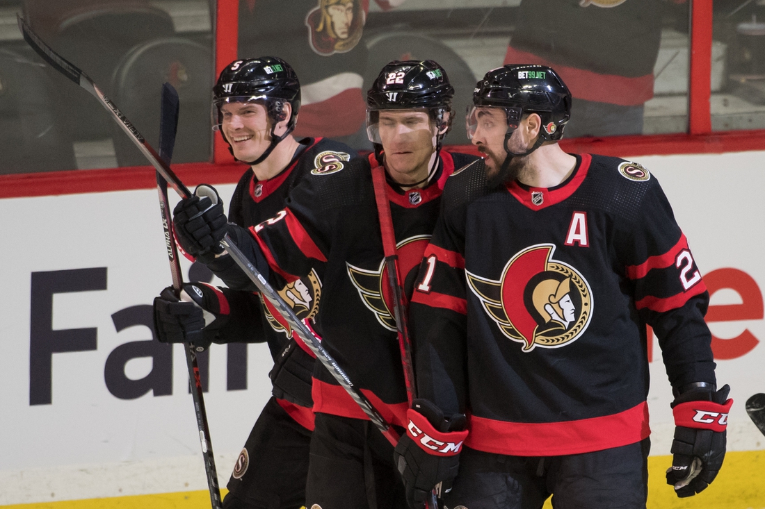 Feb 19, 2022; Ottawa, Ontario, CAN; Ottawa Senators defenseman Nick Holden (5) celebrates his goal scored in the third period against the Boston Bruins at the Canadian Tire Centre. Mandatory Credit: Marc DesRosiers-USA TODAY Sports