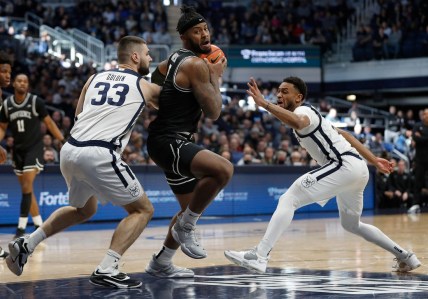 Butler Bulldogs forward Bryce Golden (33) and Butler guard Aaron Thompson (2) surround Providence Friars center Nate Watson (0) during the first half of the game Sunday, Feb. 20, 2022, at Hinkle Fieldhouse in Indianapolis. Providence edged Butler in overtime for the win, 71-70.

Butler Bulldogs Versus Providence Friars On Sunday Feb 20 2022 At Hinkle Fieldhouse In Indianapolis