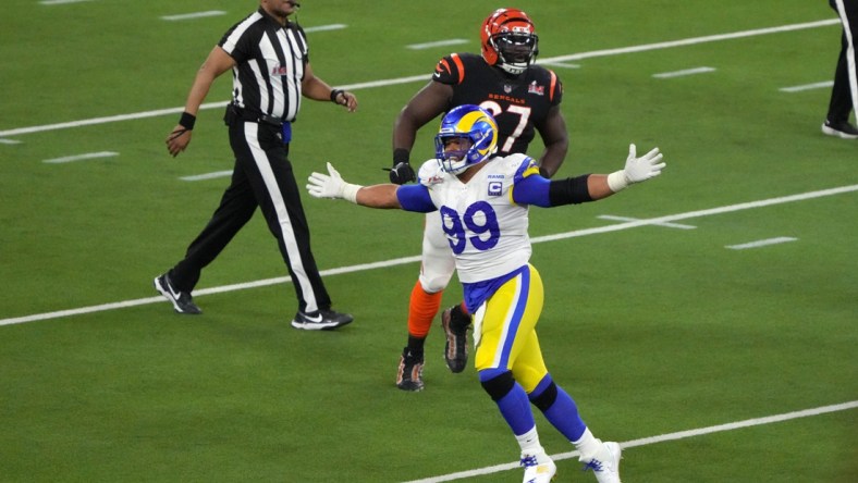 Feb 13, 2022; Inglewood, California, USA; Los Angeles Rams defensive end Aaron Donald (99) celebrates in the fourth quarter against the Cincinnati Bengals in Super Bowl LVI at SoFi Stadium. The Rams defeated the Bengals 23-20. Mandatory Credit: Kirby Lee-USA TODAY Sports