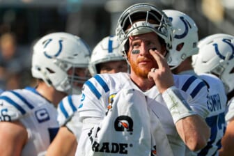 Indianapolis Colts quarterback Carson Wentz (2) presses on one of his eye black strips during the second quarter of the game on Sunday, Jan. 9, 2022, at TIAA Bank Field in Jacksonville, Fla.The Indianapolis Colts Versus Jacksonville Jaguars On Sunday Jan 9 2022 Tiaa Bank Field In Jacksonville Fla