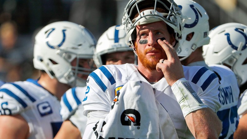 Indianapolis Colts quarterback Carson Wentz (2) presses on one of his eye black strips during the second quarter of the game on Sunday, Jan. 9, 2022, at TIAA Bank Field in Jacksonville, Fla.

The Indianapolis Colts Versus Jacksonville Jaguars On Sunday Jan 9 2022 Tiaa Bank Field In Jacksonville Fla