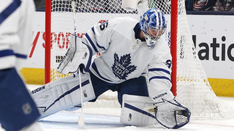 Feb 22, 2022; Columbus, Ohio, USA; Toronto Maple Leafs goalie Jack Campbell (36) makes a glove save against the Columbus Blue Jackets during the first period at Nationwide Arena. Mandatory Credit: Russell LaBounty-USA TODAY Sports