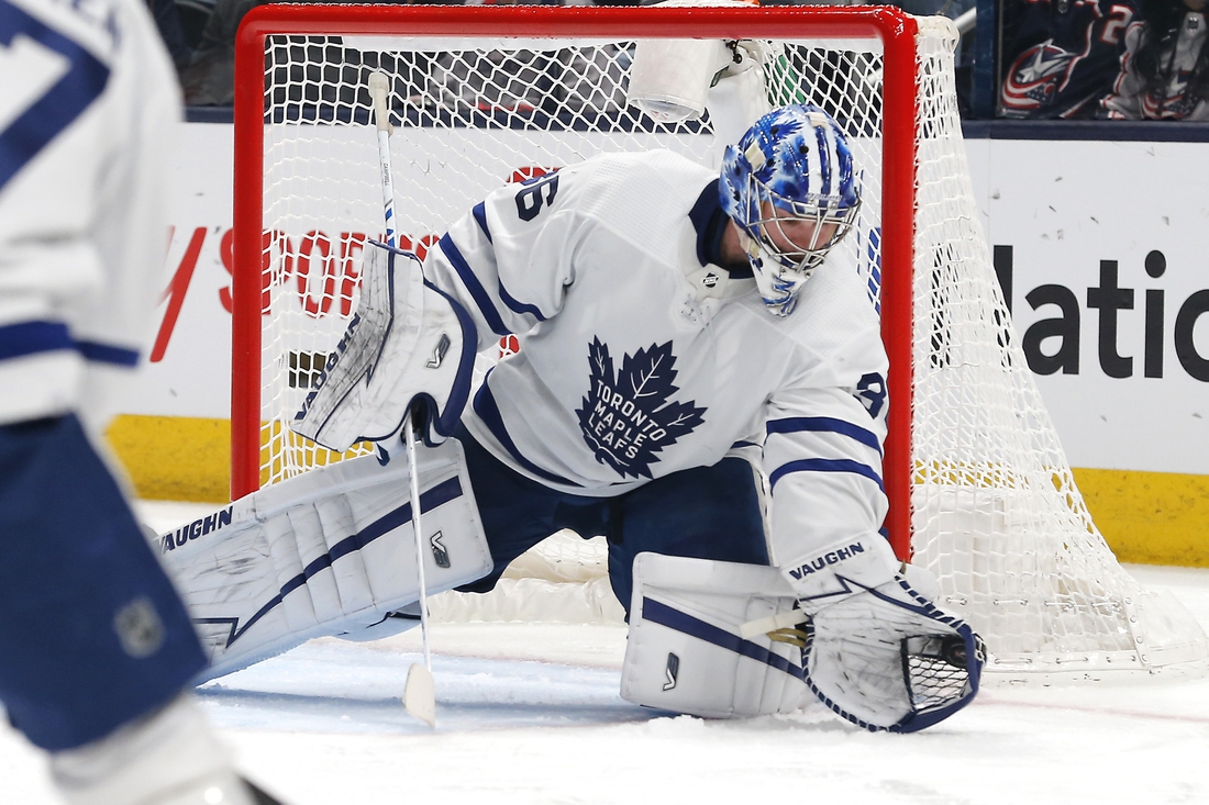Feb 22, 2022; Columbus, Ohio, USA; Toronto Maple Leafs goalie Jack Campbell (36) makes a glove save against the Columbus Blue Jackets during the first period at Nationwide Arena. Mandatory Credit: Russell LaBounty-USA TODAY Sports