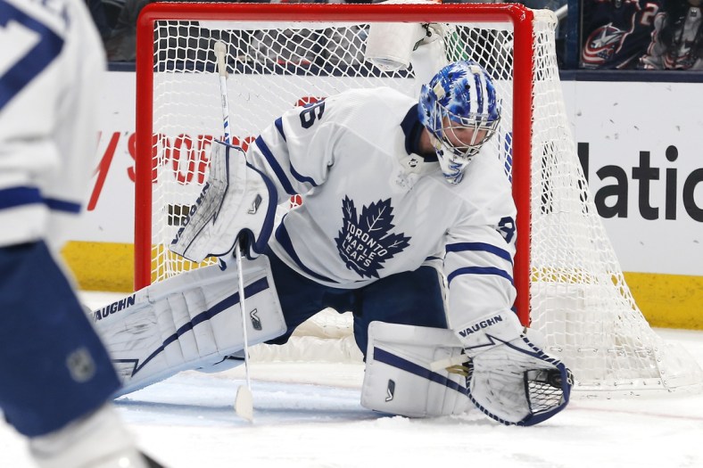 Feb 22, 2022; Columbus, Ohio, USA; Toronto Maple Leafs goalie Jack Campbell (36) makes a glove save against the Columbus Blue Jackets during the first period at Nationwide Arena. Mandatory Credit: Russell LaBounty-USA TODAY Sports