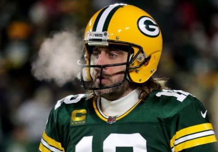 Green Bay Packers quarterback Aaron Rodgers (12) warms up before the Green Bay Packers divisional playoff game against the San Francisco 49ers at Lambeau Field in Green Bay on Saturday, Jan. 22, 2022.Packers 2766