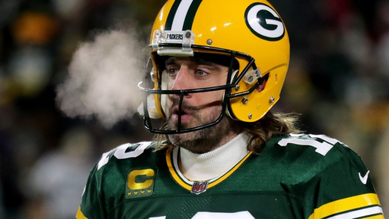 Green Bay Packers quarterback Aaron Rodgers (12) warms up before the Green Bay Packers divisional playoff game against the San Francisco 49ers at Lambeau Field in Green Bay on Saturday, Jan. 22, 2022.Packers 2766