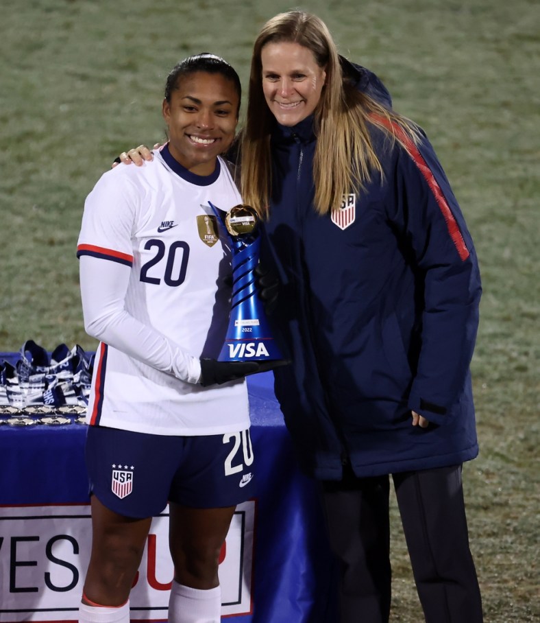 Feb 23, 2022; Frisco, Texas, USA; USA midfilder Catarina Macario (20) celebrates being named MVP with US Soccer president Cindy Parlow Cone (R) after defeating Iceland in the 2022 She Believes Cup international soccer match at Toyota Stadium. Mandatory Credit: Kevin Jairaj-USA TODAY Sports