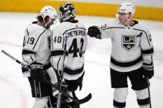 Feb 23, 2022; Glendale, Arizona, USA; Los Angeles Kings left wing Alex Iafallo (19) and Los Angeles Kings goaltender Cal Petersen (40) and Los Angeles Kings right wing Dustin Brown (23) celebrate after the third period against the Arizona Coyotes at Gila River Arena. Mandatory Credit: Joe Camporeale-USA TODAY Sports