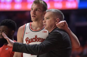 Feb 24, 2022; Champaign, Illinois, USA;  Ohio State Buckeyes head coach Chris Holtmann and player Justin Ahrens (10) talk during the bench during the first half against the Illinois Fighting Illini at State Farm Center. Mandatory Credit: Ron Johnson-USA TODAY Sports