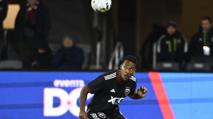 Feb 26, 2022; Washington, District of Columbia, USA; D.C. United forward Ola Kamara (9) heads the ball in the second half against the Charlotte FC  at Audi Field. Mandatory Credit: Brad Mills-USA TODAY Sports