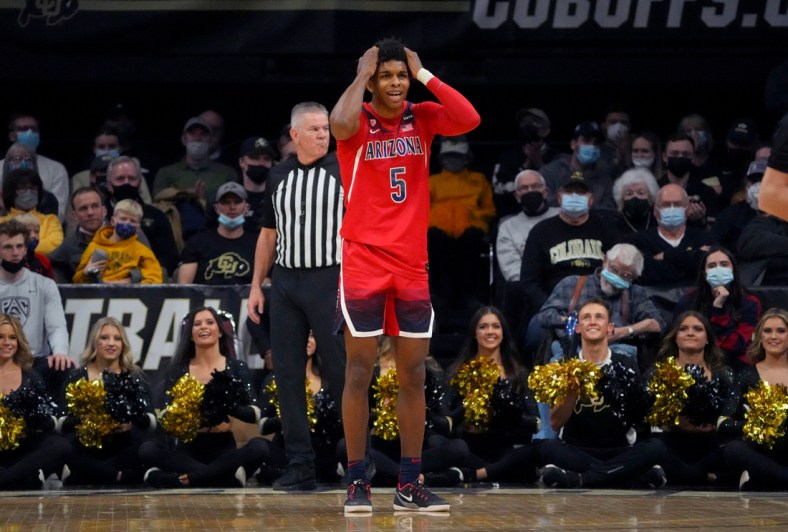 Feb 26, 2022; Boulder, Colorado, USA; Arizona Wildcats guard Justin Kier (5) reacts during the second half against the Colorado Buffaloes at the CU Events Center. Mandatory Credit: Ron Chenoy-USA TODAY Sports