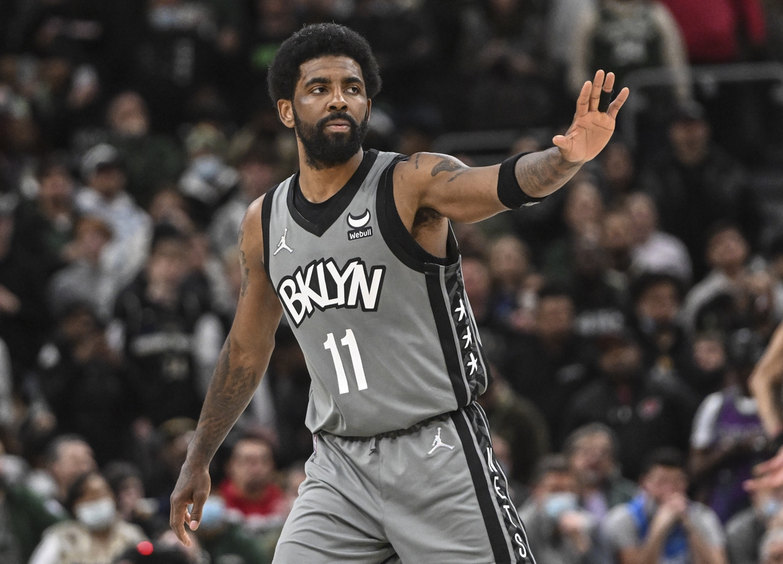 Feb 26, 2022; Milwaukee, Wisconsin, USA; Brooklyn Nets guard Kyrie Irving (11) reacts during a timeout in the fourth quarter against the Milwaukee Bucks at Fiserv Forum. Mandatory Credit: Benny Sieu-USA TODAY Sports