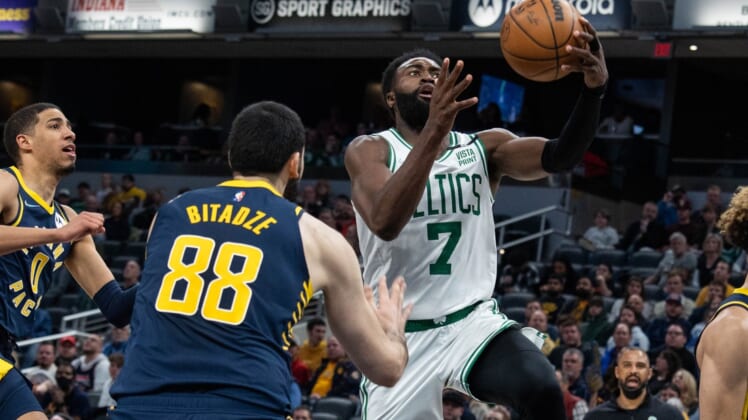Feb 27, 2022; Indianapolis, Indiana, USA; Boston Celtics guard Jaylen Brown (7) shoots the ball while Indiana Pacers center Goga Bitadze (88) defends in the second half at Gainbridge Fieldhouse. Mandatory Credit: Trevor Ruszkowski-USA TODAY Sports