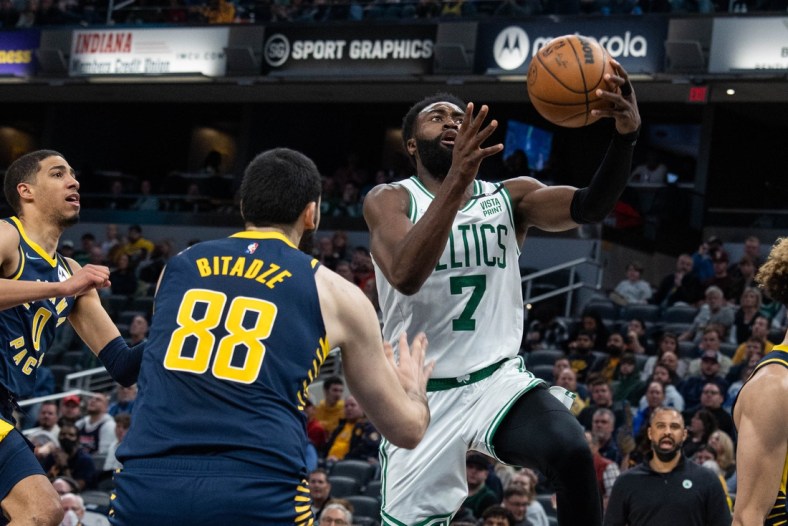 Feb 27, 2022; Indianapolis, Indiana, USA; Boston Celtics guard Jaylen Brown (7) shoots the ball while Indiana Pacers center Goga Bitadze (88) defends in the second half at Gainbridge Fieldhouse. Mandatory Credit: Trevor Ruszkowski-USA TODAY Sports