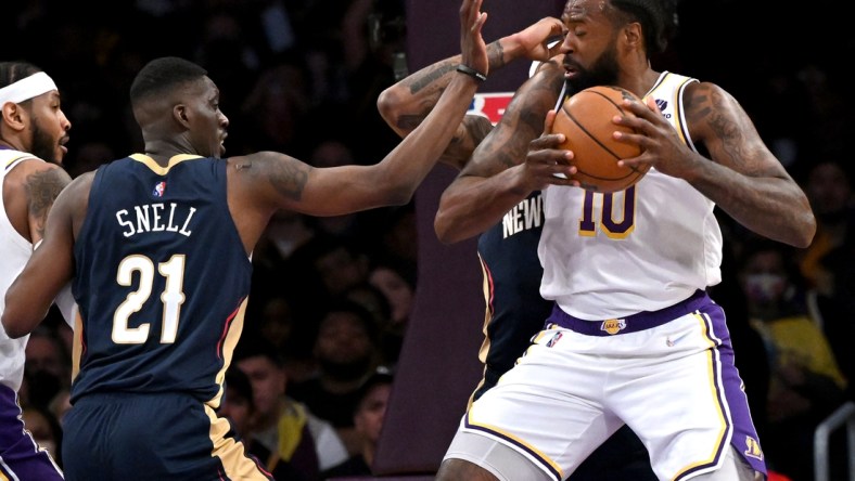 Feb 27, 2022; Los Angeles, California, USA; Los Angeles Lakers center DeAndre Jordan (10) is defended by New Orleans Pelicans forward Tony Snell (21) in the second half of the game at Crypto.com Arena. Mandatory Credit: Jayne Kamin-Oncea-USA TODAY Sports