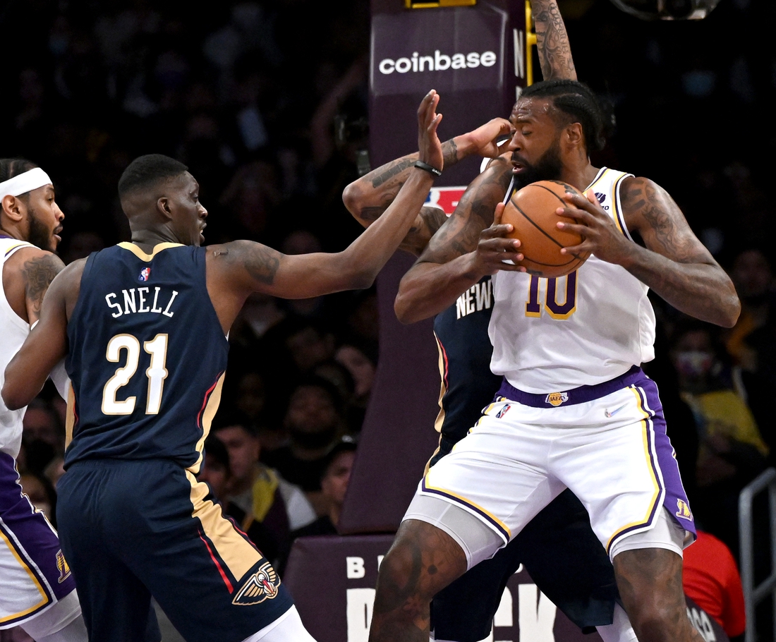 Feb 27, 2022; Los Angeles, California, USA; Los Angeles Lakers center DeAndre Jordan (10) is defended by New Orleans Pelicans forward Tony Snell (21) in the second half of the game at Crypto.com Arena. Mandatory Credit: Jayne Kamin-Oncea-USA TODAY Sports