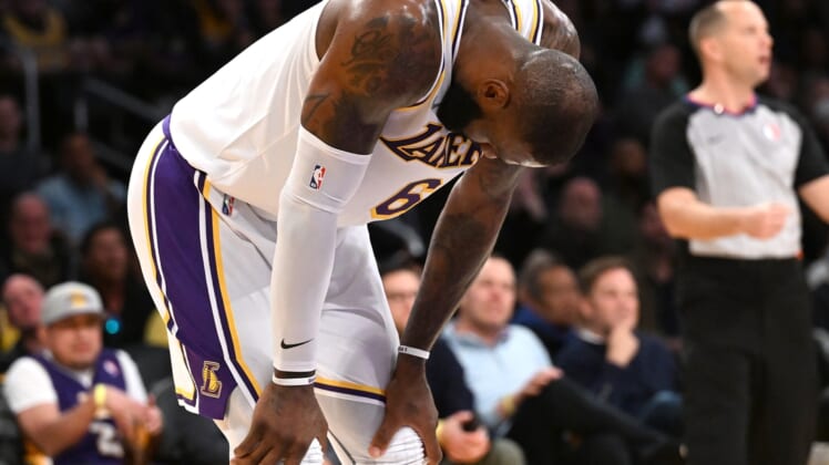 Feb 27, 2022; Los Angeles, California, USA; Los Angeles Lakers forward LeBron James (6) rests his hands on his leg during a time out in the second half against the New Orleans Pelicans at Crypto.com Arena. Mandatory Credit: Jayne Kamin-Oncea-USA TODAY Sports
